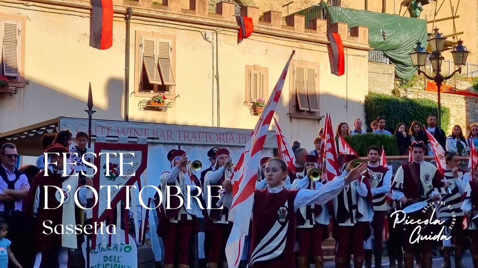Festa d’Ottobre a Sassetta, parata con bandiere e musica, esperienza culturale in Val di Cornia.